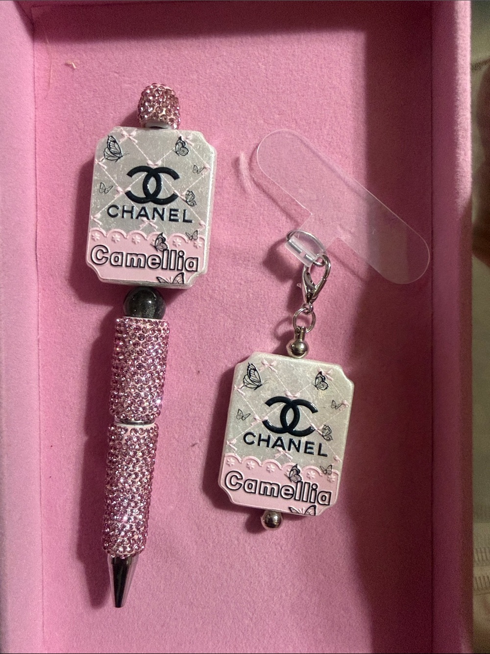 Pink rhinestone pen with large charm and matching phone charm w/attachment.